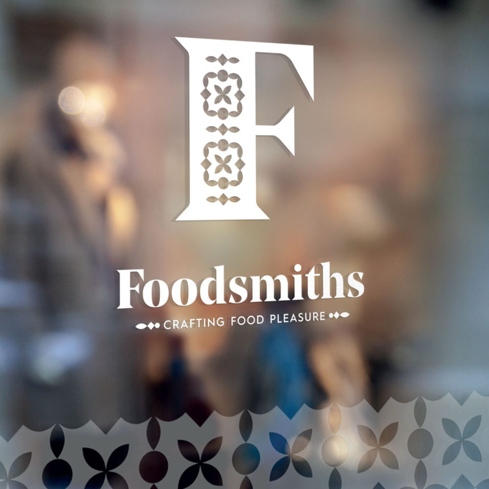 Foodsmiths logo on glass